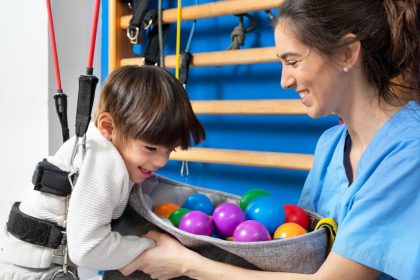 cute-kid-with-cerebral-palsy-doing-musculoskeletal-therapy-hospital-while-laughing-having_56854-4179